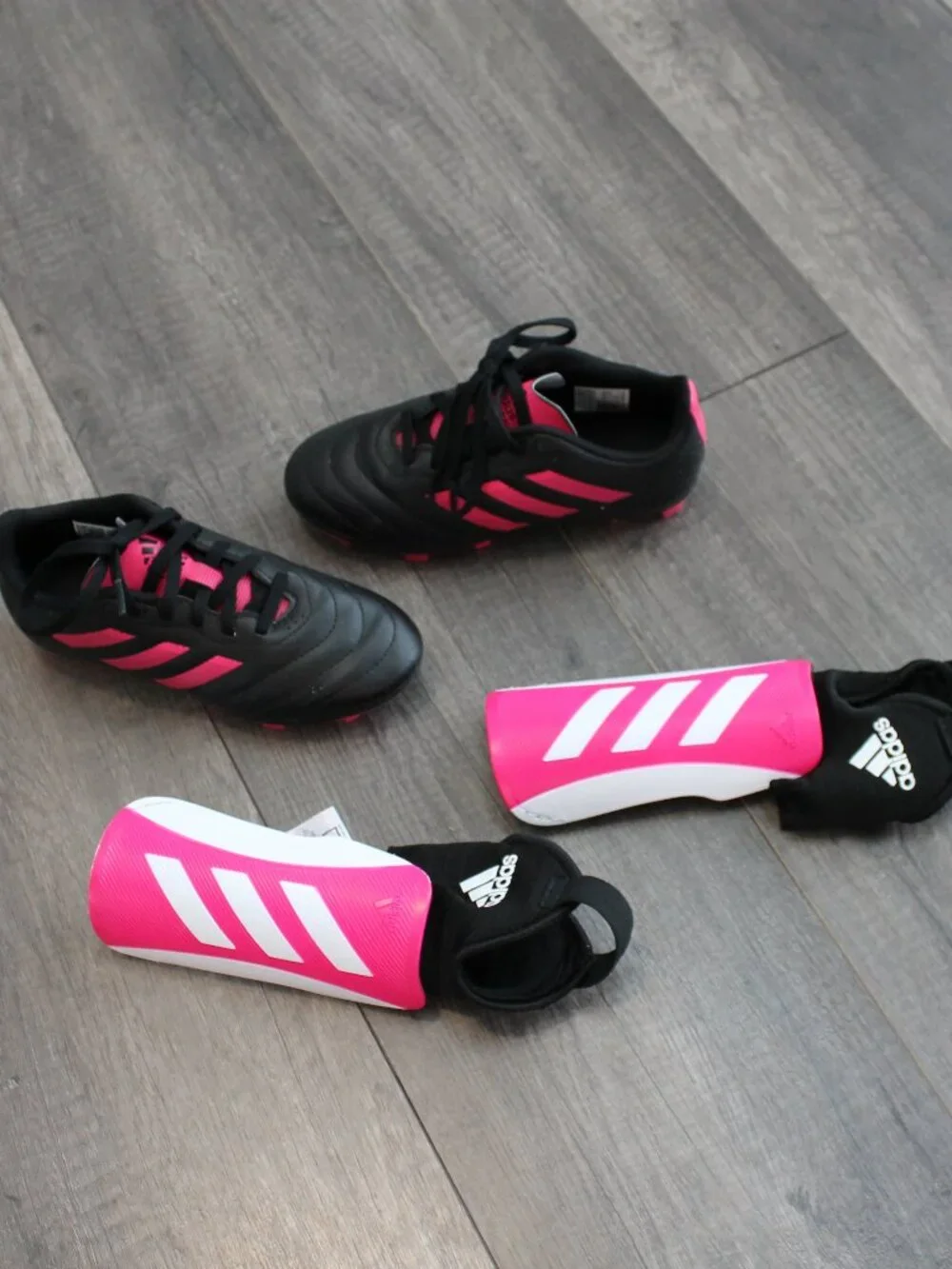 Adidas soccer cleats and shin guards
